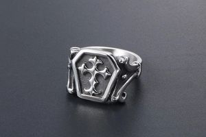 Macro view of gothic titanium steel ring with hexagon coffin shape and cross relief