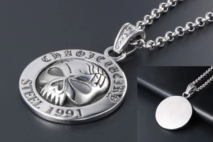 Macro detail of gothic stainless steel skull pendant with vintage 1991 embossed engraving