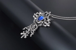 Gothic cross pendant with blue stone and dragon motif on stainless steel chain