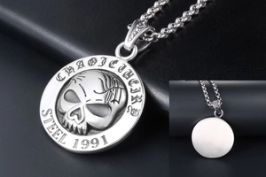 Macro detail of gothic 1991 skull pendant showing stainless steel texture and engraving