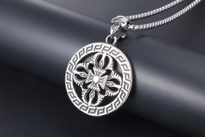 Macro view of vintage titanium steel necklace with vajra pendant and skull clasp detail
