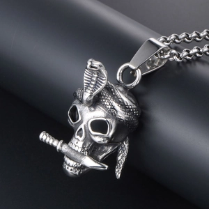Gothic punk skull pendant necklace with dagger and cobra detail in vintage steel