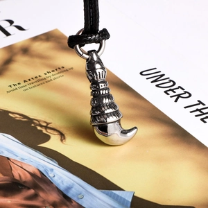 Retro wolf tooth pendant in silver titanium steel with black woven rope for men