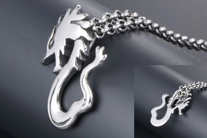Detail of silver dragon pendant showing industrial style link chain and polished metal texture