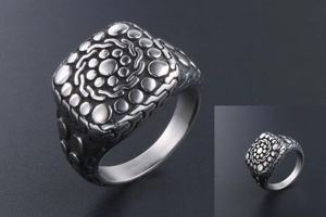 Macro detail of vintage silver titanium steel ring with cobblestone pattern and matte finish