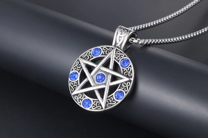 Detailed macro view of vintage Celtic star pendant featuring sparkling blue rhinestones