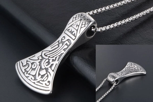 Detail of Viking battle axe pendant with Nordic runes and vintage silver finish on box chain