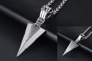 Detail of silver triangle arrow pendant with textured bail and polished metal finish