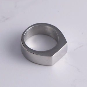 Minimalist matte titanium steel rectangular ring with a brushed geometric finish
