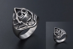 Close-up of vintage skull reaper carving on a retro titanium steel ring for men