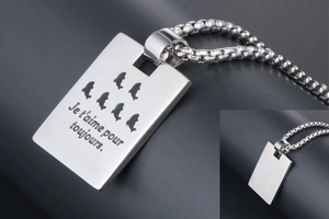 Detail showing polished titanium steel tag necklace with French romantic engraving