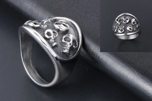 Macro detail of gothic skull ring with oxidized vintage finish on steel band