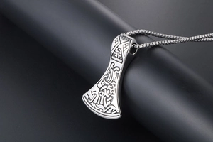 Macro shot of a Viking axe pendant with Celtic knot patterns and S925 hallmark