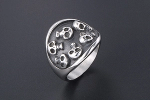 Detailed view of the gothic skull embossed patterns on this matte titanium steel ring
