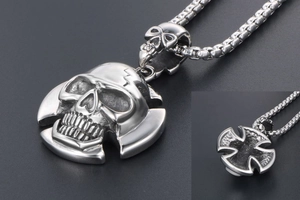 Close-up of punk skull pendant in polished steel with detailed back hollow design
