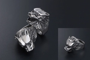 Detailed close-up showing the 3D embossed texture of a vintage wolf head steel ring