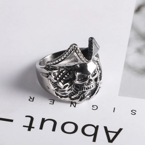 Macro shot of vintage skull ring detailing the distressed steel texture and pirate hat