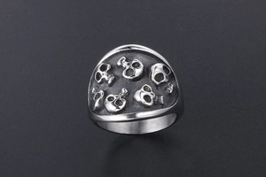 Detail view of gothic skull shield ring in vintage stainless steel with rock punk style