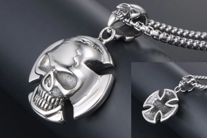 Detailed view of punk skull cross pendant in vintage polished stainless steel with box chain