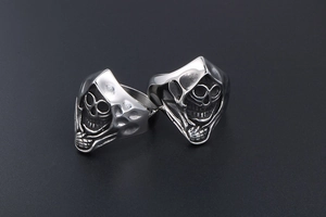 Close-up of vintage gothic skull rings in titanium steel with black oxidized finish