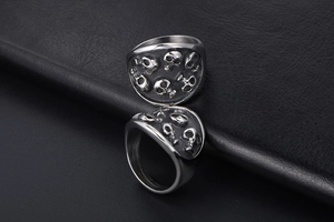 Macro detail of gothic skull relief on vintage silver-grey titanium steel ring
