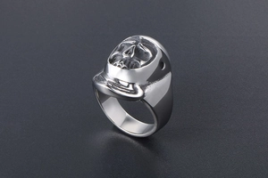 Detailed view of silver stainless steel skull ring with helmet in gothic rock style