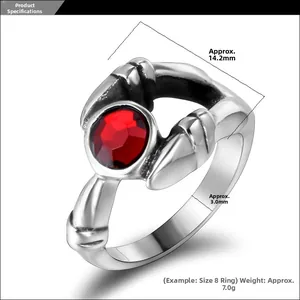 Macro shot of gothic titanium ring with red gemstone and detailed four-prong setting