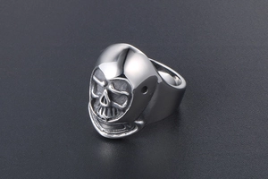 Macro detail of men's skull helmet ring in silver stainless steel with retro finish