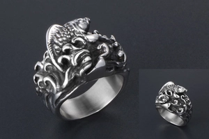 Detailed relief of koi fish and waves on a vintage stainless steel wide band ring