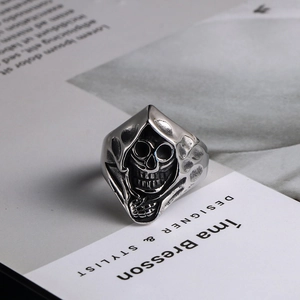 Vintage hooded skull ring for men in titanium steel with a gothic punk aesthetic