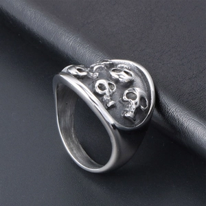 Punk style stainless steel skull ring with vintage embossed design for men on leather