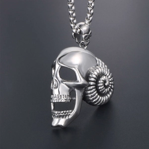 Gothic skull pendant with spiral ram horns on silver tone square chain necklace
