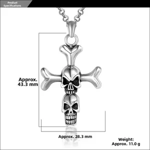 Detail view of gothic cross pendant with two skulls showing size of 43.3mm by 28.3mm