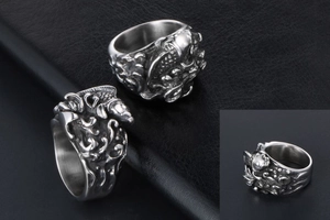 Macro detail of retro koi fish relief with water waves on vintage stainless steel ring