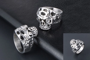 Detailed macro view of punk style skull rings featuring intricate hollow carving on titanium steel
