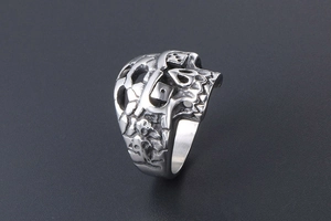 Detailed close-up of a punk skull and dice engraving on a vintage titanium steel ring