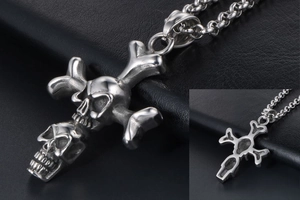 Detailed macro view of the punk skull and crossbones pendant with textured metal finish