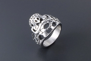 Macro view of punk skull and dice engraving on vintage silver titanium steel ring