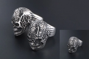 Macro view of vintage steampunk skull ring showing intricate mechanical gear details