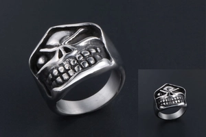 Macro shot of punk skull ring with detailed relief and vintage oxidized finish