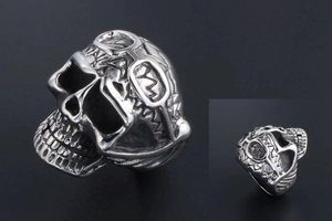 Detailed close-up of retro punk skull ring with goggle and lightning bolt engraving