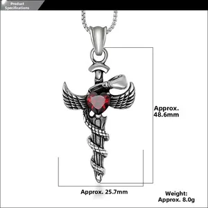 Macro shot of titanium steel sword pendant with angel wings and heart red zircon