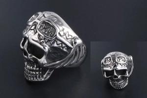 Macro detail of punk skull ring with goggle design in antique silver finish