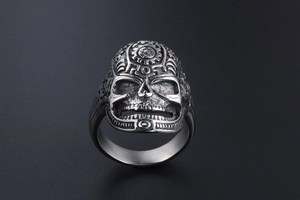 Macro shot of vintage steampunk skull ring with detailed mechanical gears and bearings