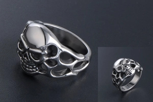 Close-up of vintage gothic skull ring with hollowed details and aged silver finish