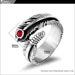 Macro view of vintage gothic feather ring with red stone and dimension markings