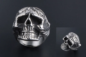 Macro detail of a punk retro skull ring in cast titanium steel with silver finish