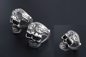 Macro detail of punk skull ring with carved aviator goggles and antique steel texture