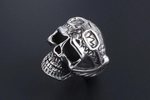 Detailed view of punk skull ring with goggles made of polished stainless steel