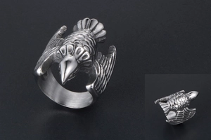 Detailed view of the vintage titanium steel ring featuring intricate flying bird feather textures